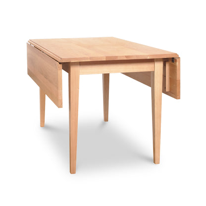 Lyndon Furniture Drop Leaf Table in natural cherry wood with one leaf extended and one leaf down, highlighting its versatile design and craftsmanship.