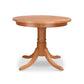 A Lyndon Furniture Duncan-Phyfe Round Pedestal Dining Table with a round solid top and wooden base.
