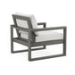 A modern POLYWOOD® EDGE Club Chair with a sturdy frame and white cushions displayed against a white background, boasting a minimalist and contemporary outdoor design.