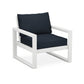 A modern POLYWOOD® EDGE Club Chair with a white metal frame and dark blue cushions, isolated on a white background.