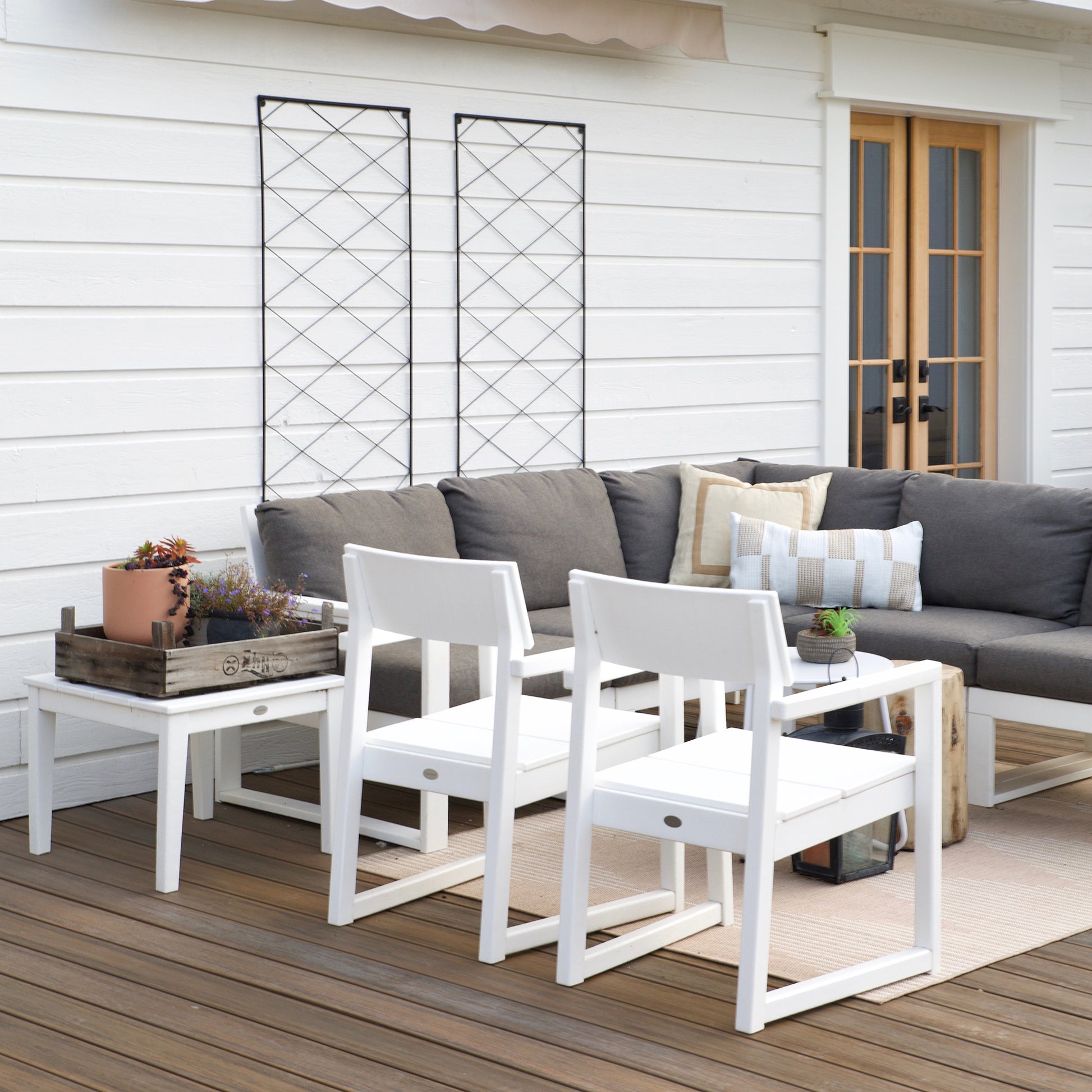 POLYWOOD EDGE Dining Chair and gray sectional sofa as the centerpiece, showcasing premium American made outdoor furniture.