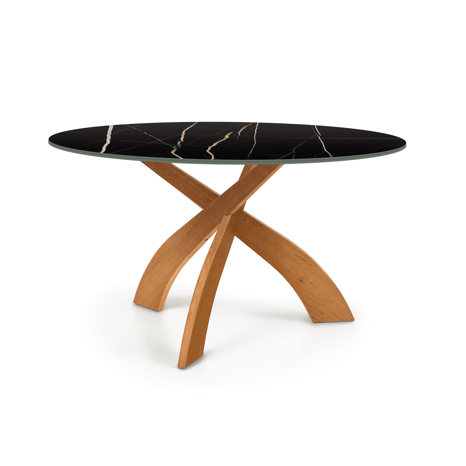 Round sintered stone top table with white veining and cherry wood base by Copeland Furniture Entwine.