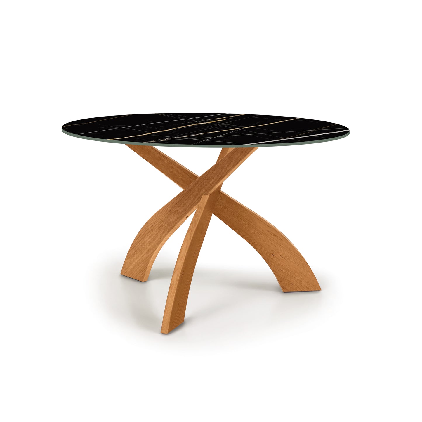 Round black marble top Entwine Table with cherry wood base by Copeland Furniture.