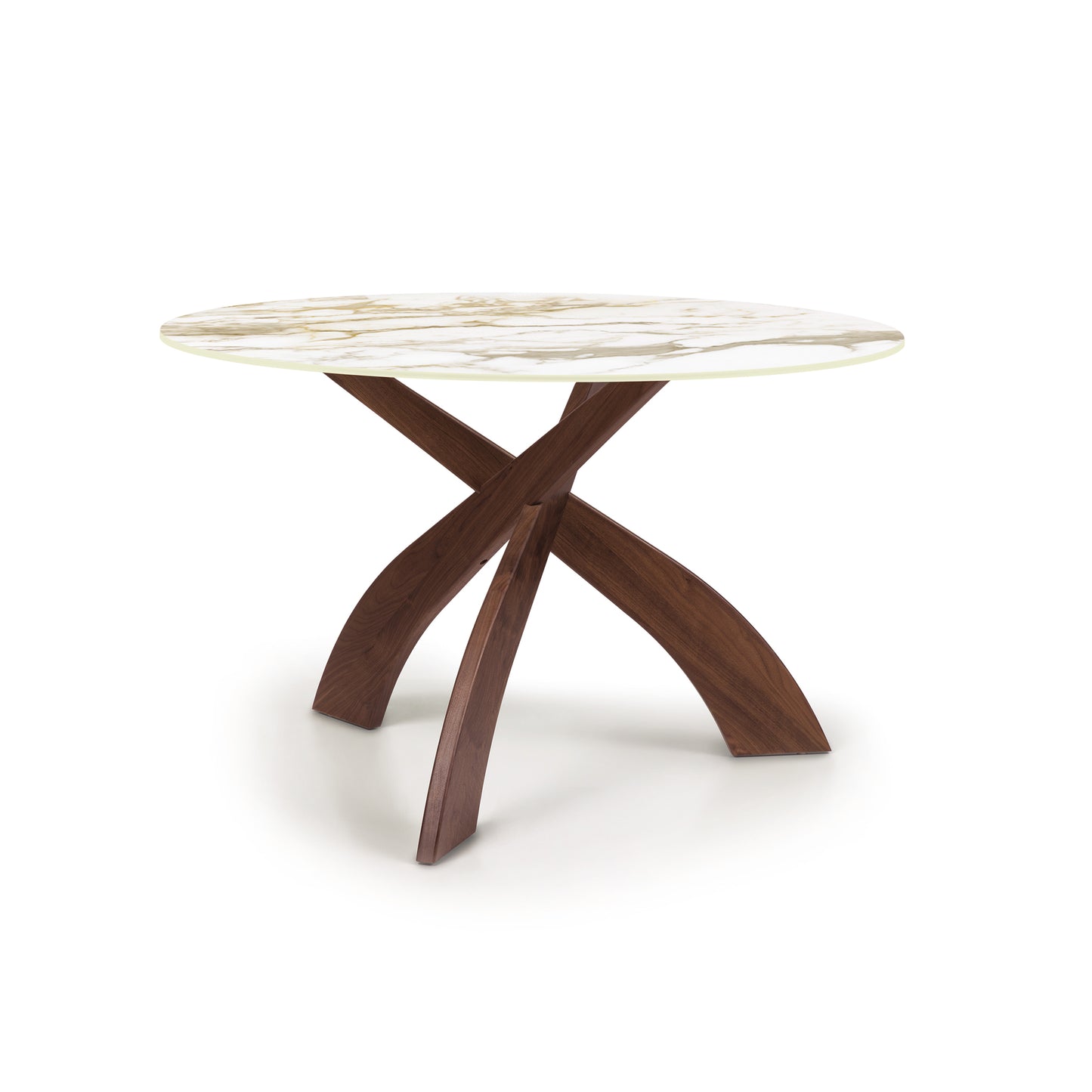 Entwine Round Table with marble-style sintered stone top and elegant crossed cherry wood legs by Copeland Furniture.