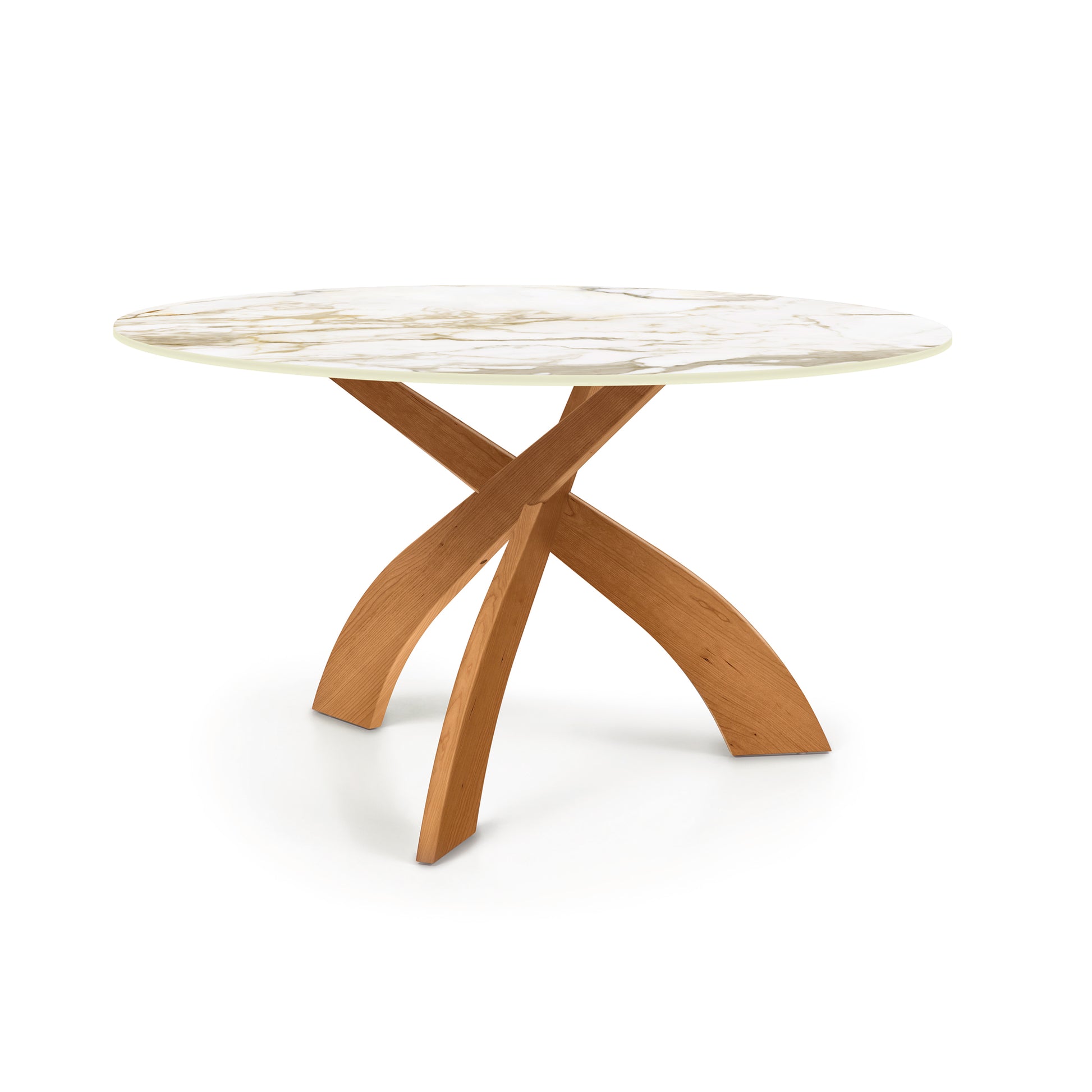 Entwine Table by Copeland Furniture featuring a round sintered stone top and a distinctive intersecting cherry wood base.