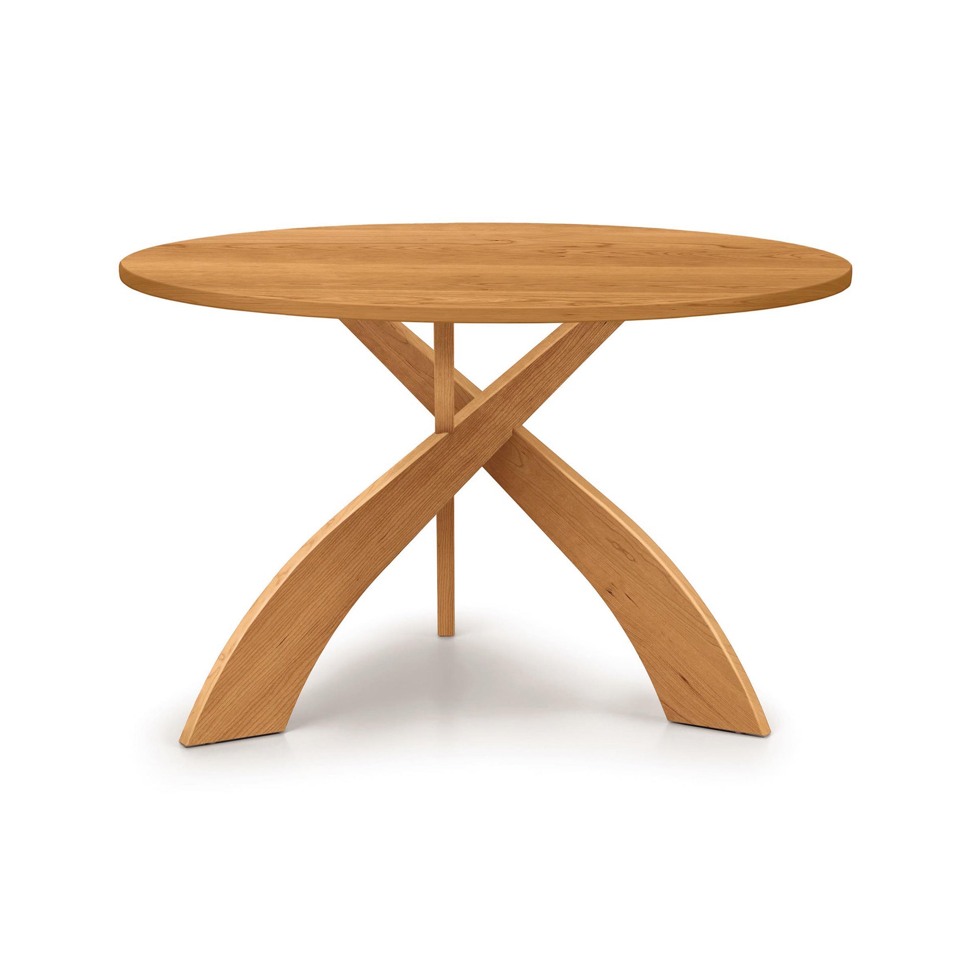 Entwine Round Solid Top Table by Copeland Furniture with three elegant curved legs and a smooth wood top, handcrafted in Vermont from quality hardwoods.