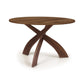 Entwine Round Solid Top Table by Copeland Furniture, crafted in solid wood with three elegant curved legs and a smooth round top, American-made.