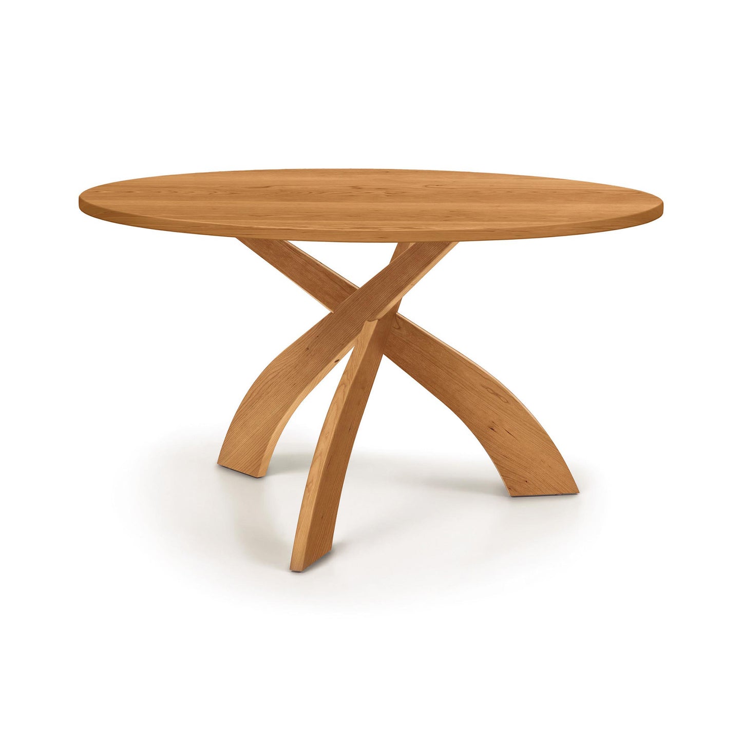 Entwine Round Solid Top Table by Copeland Furniture showcases cherry wood and unique intersecting curved legs, highlighting its American craftsmanship.
