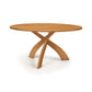 Entwine Round Solid Top Table by Copeland Furniture with cherry wood top and three curved intersecting legs, crafted in Vermont, American made.