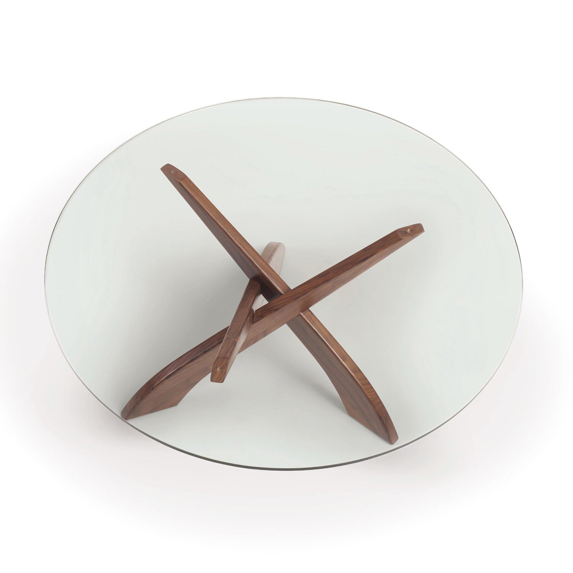 An Entwine Round Coffee Table from Copeland Furniture for your living room with a wooden cross on top.