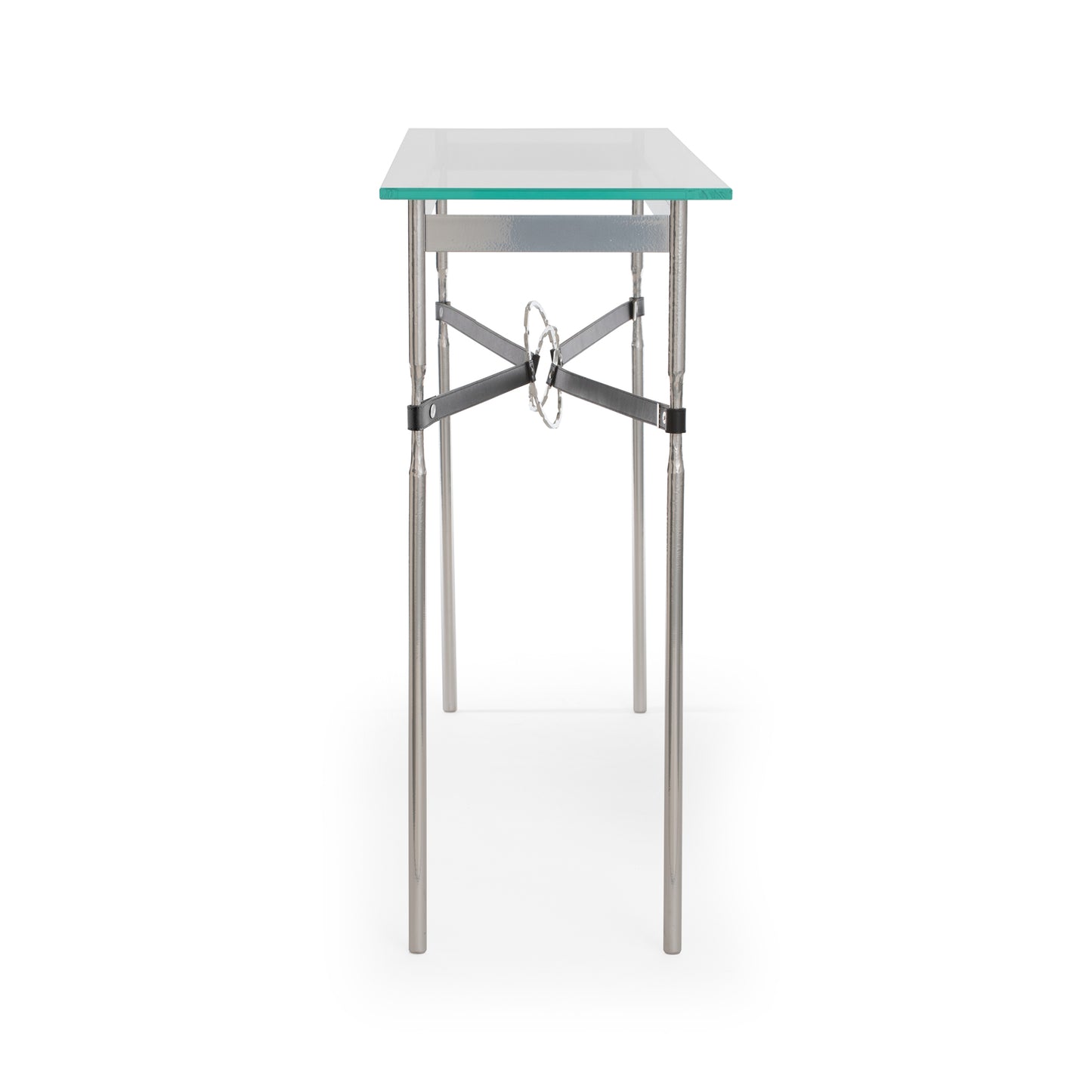 An Equus Console Table by Hubbardton Forge with metal legs and a tempered glass top.