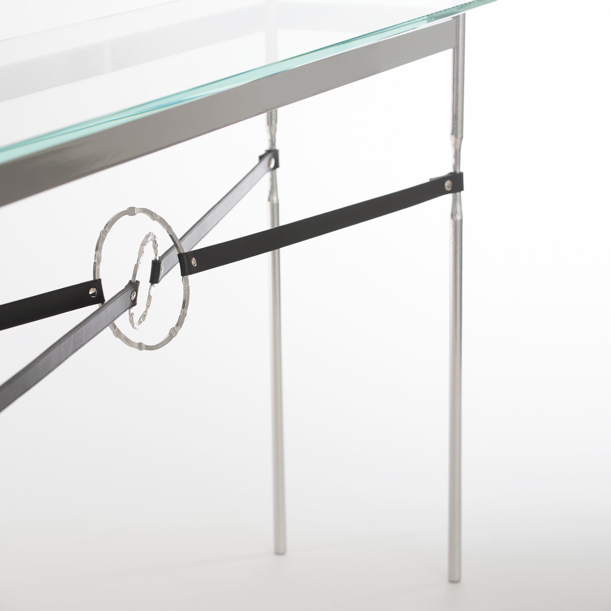 An Equus Console Table by Hubbardton Forge, artisanal-made with a metal frame.