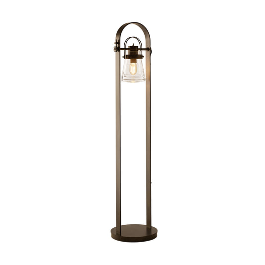 The Hubbardton Forge Erlenmeyer Floor Lamp is a sleek metal floor lamp with a glass shade. Designed with elements of steampunk, this unique piece showcases the creativity and craftsmanship of Hubbardton Forge.