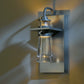 The Erlenmeyer Medium Outdoor Sconce by Hubbardton Forge showcases expert American metalwork and glass, enhancing outdoor furniture with timeless style.
