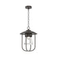 Hubbardton Forge Erlenmeyer Outdoor Pendant with black metal frame, clear glass shade, and exposed bulb, crafted in Vermont for quality and style.