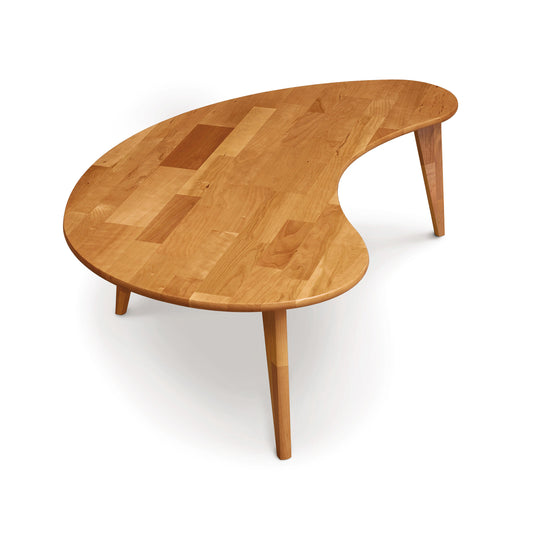 A mid-century modern Essentials Kidney Shaped Coffee Table with Wood Legs from Copeland Furniture on a white background.
