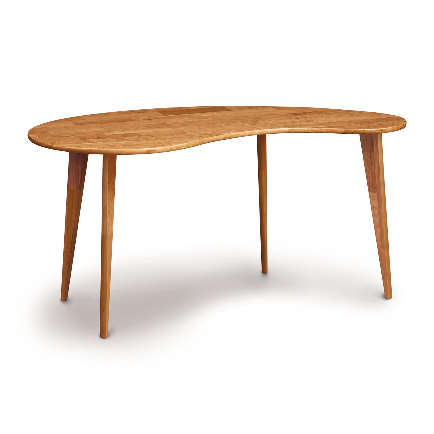 A natural hardwood Essentials Kidney Shaped Desk with Wood Legs by Copeland Furniture isolated on a white background.