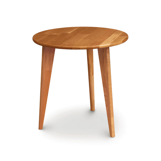 A Essentials Round End Table with Wood Legs from Copeland Furniture, with three legs on a white background.