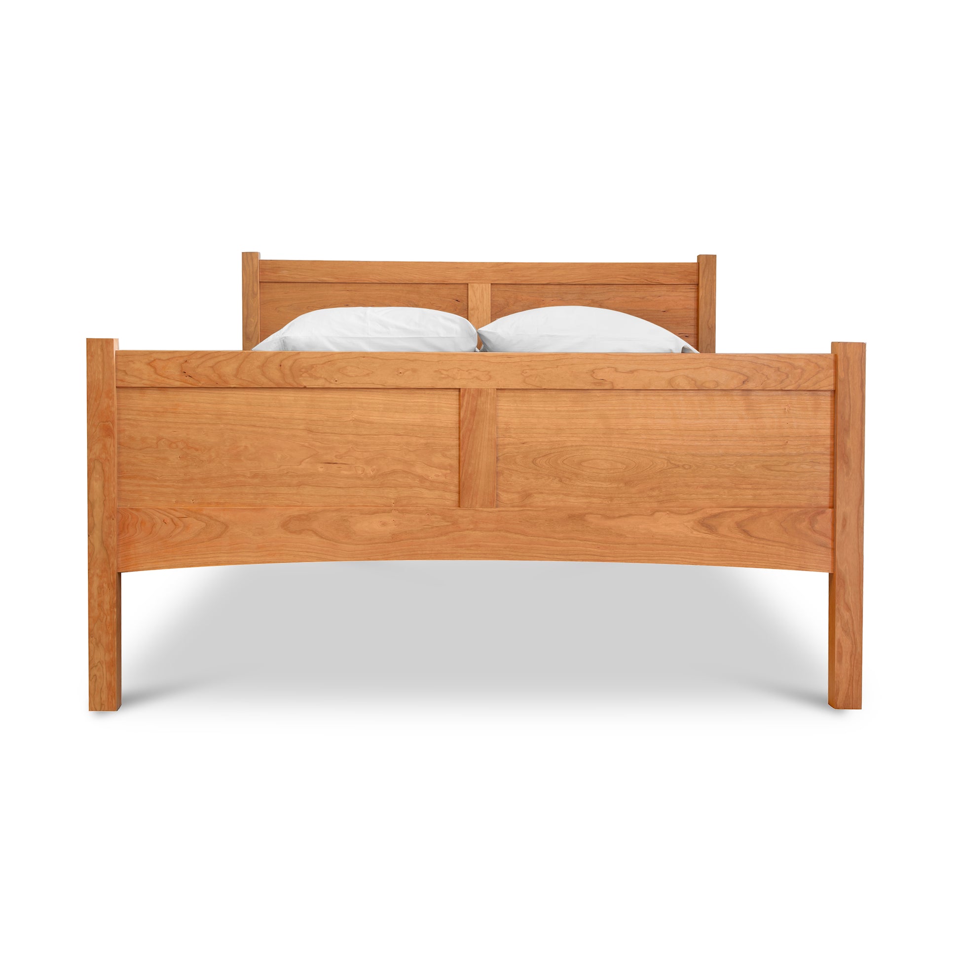 Essex High Footboard Bed by Vermont Furniture Designs, showcasing its tall headboard and footboard in quality hardwood, accented by two white pillows.
