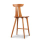 Estelle Counter Stool by Copeland Furniture showcasing mid-century modern design, curved backrest, angled legs, and footrest. American made quality.