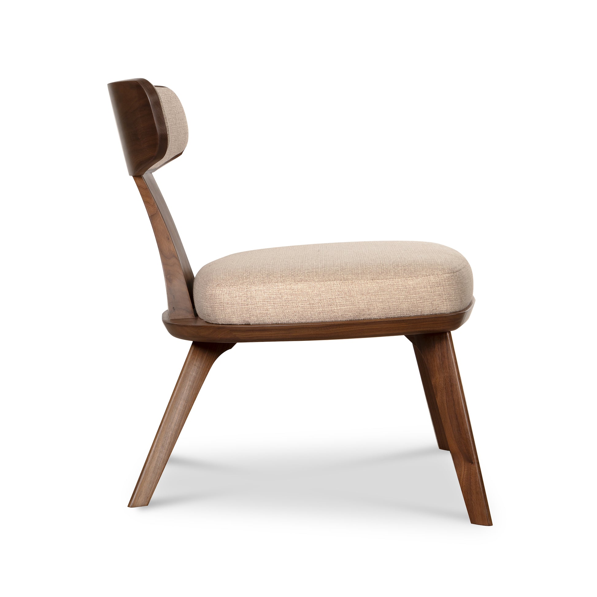 Estelle Lounge Chair by Copeland Furniture shown from the side, showcasing its solid wood frame and beige upholstered seat and backrest.