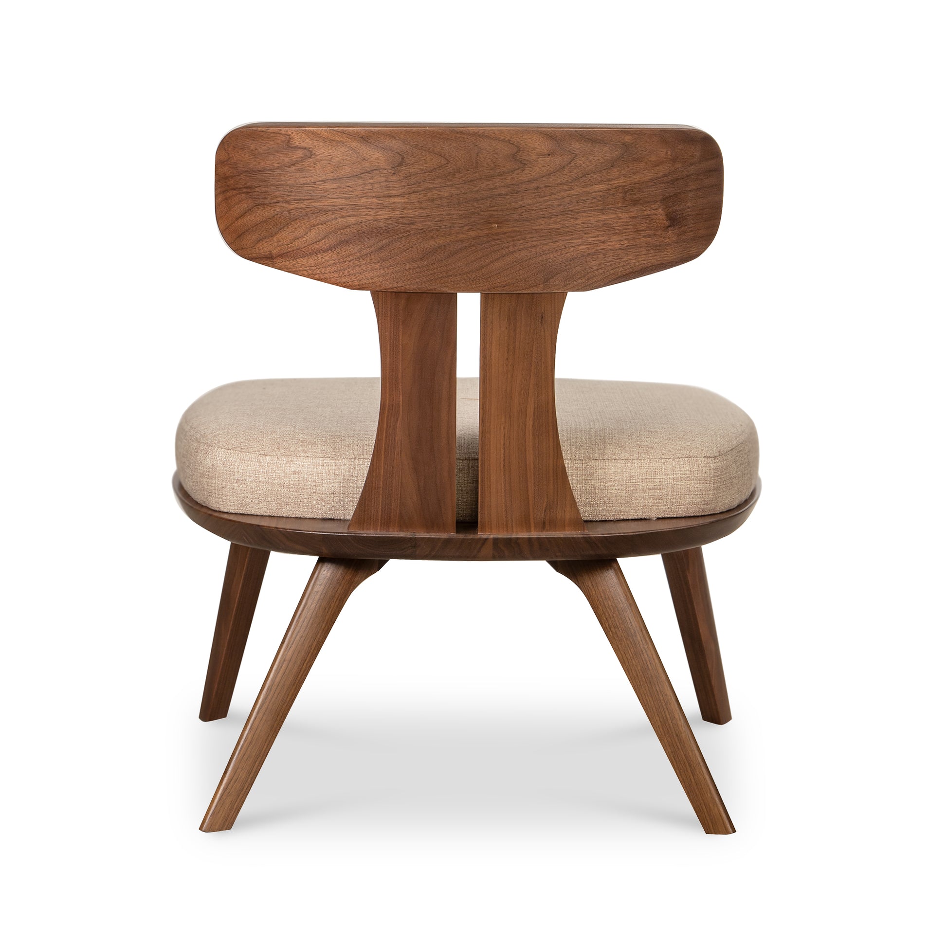 Estelle Lounge Chair by Copeland Furniture with angled back, beige cushion, and splayed mid-century modern legs; focus on chair craftsmanship.