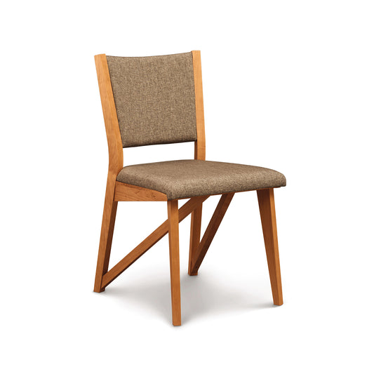 A modern style Exeter Chair from the Copeland Furniture Collection with a tan upholstered seat and backrest, isolated on a white background.