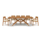 Exeter Extension Dining Table by Copeland Furniture featuring a distinctive wooden X-shaped base, complemented by six cushioned chairs and a convenient butterfly leaf extension.