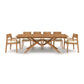 A wooden dining table with six chairs.