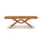 Copeland Furniture Exeter Extension Dining Table featuring a crisscross base and butterfly leaf.