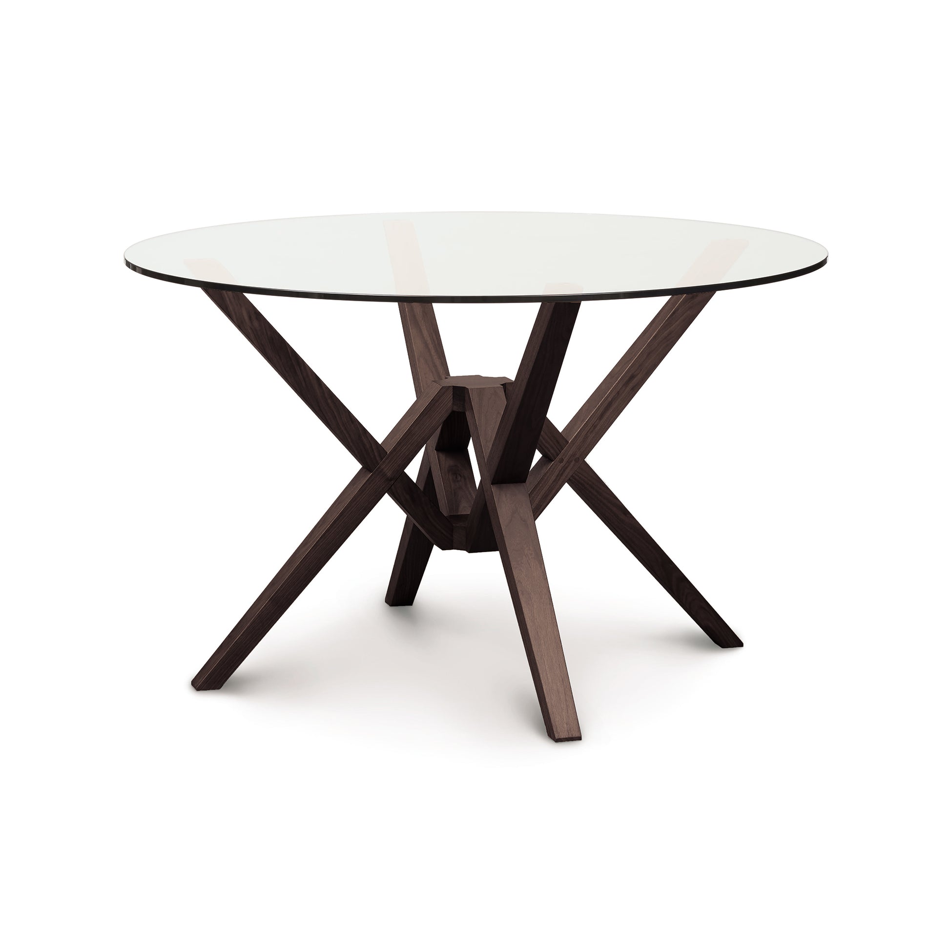An innovative engineering marvel, the Copeland Furniture Exeter Round Glass Top Table showcases isometric design with its wooden base complementing the elegant glass surface.