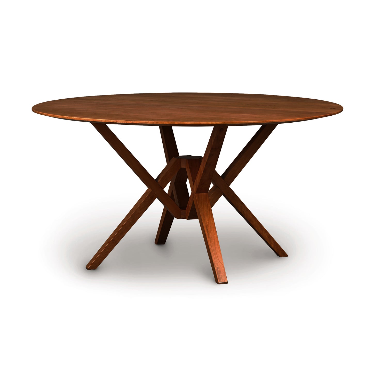 A Copeland Furniture Exeter Round Solid Top Dining Table with a cross-leg support design, crafted from sustainably harvested hardwoods, on a white background.