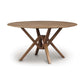 A Copeland Furniture Exeter Round Solid Top Dining Table, crafted from sustainably harvested hardwoods, with a cross-shaped base isolated on a white background.
