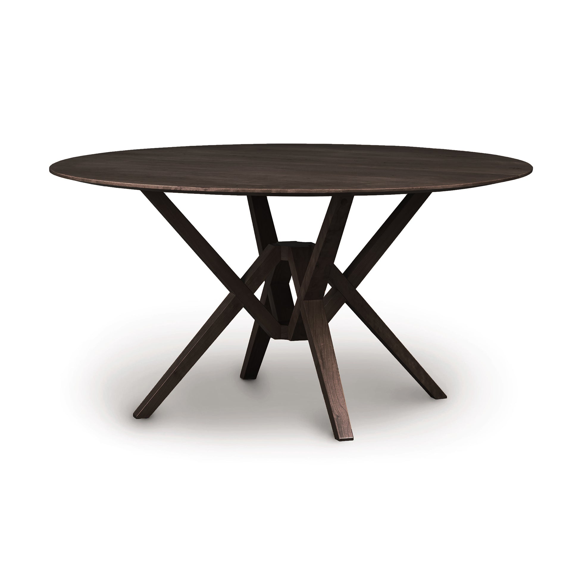 Round wooden Exeter Round Solid Top Dining Table with a cross-shaped base, isolated on a white background. Crafted from sustainably harvested hardwoods by Copeland Furniture.