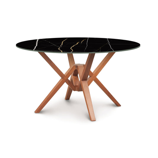 Exeter Round Table with glossy black marble-top and geometric hardwood base by Copeland Furniture.