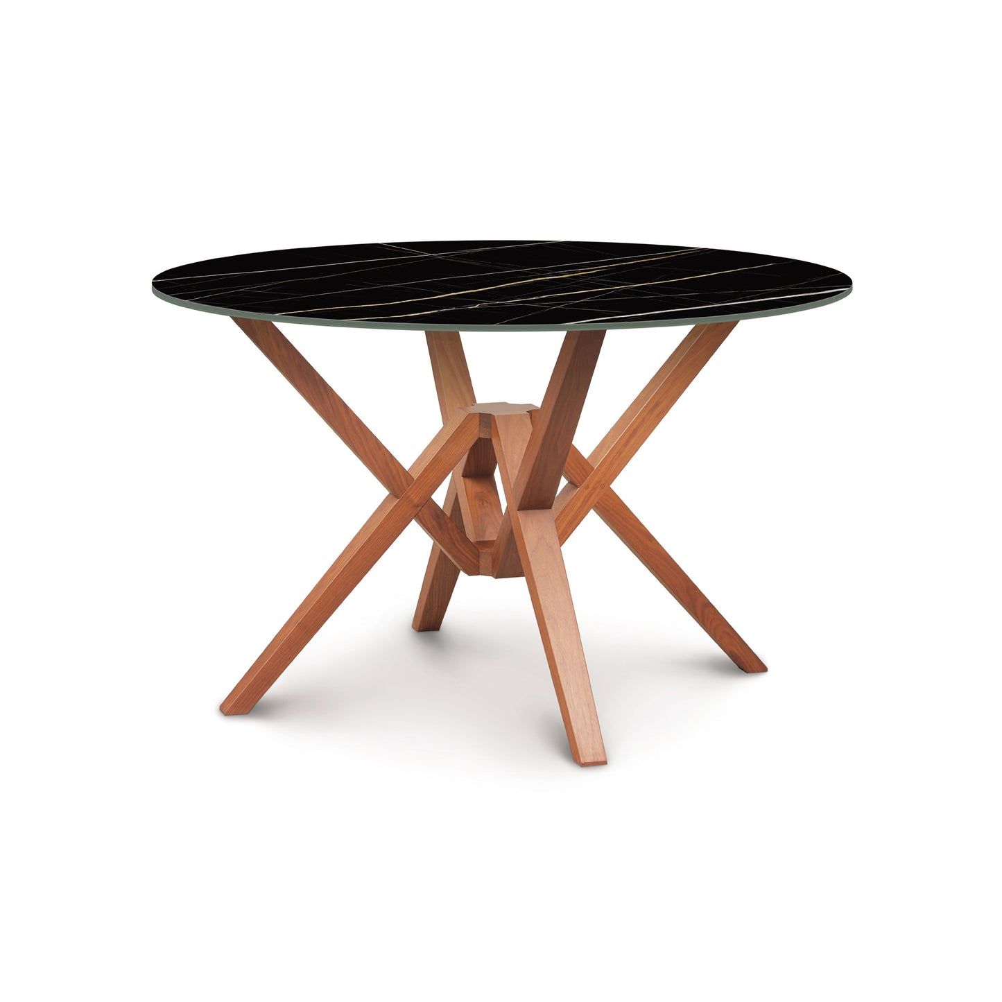 Copeland Exeter Round Table with black sintered stone top and geometric sustainably harvested hardwood legs.