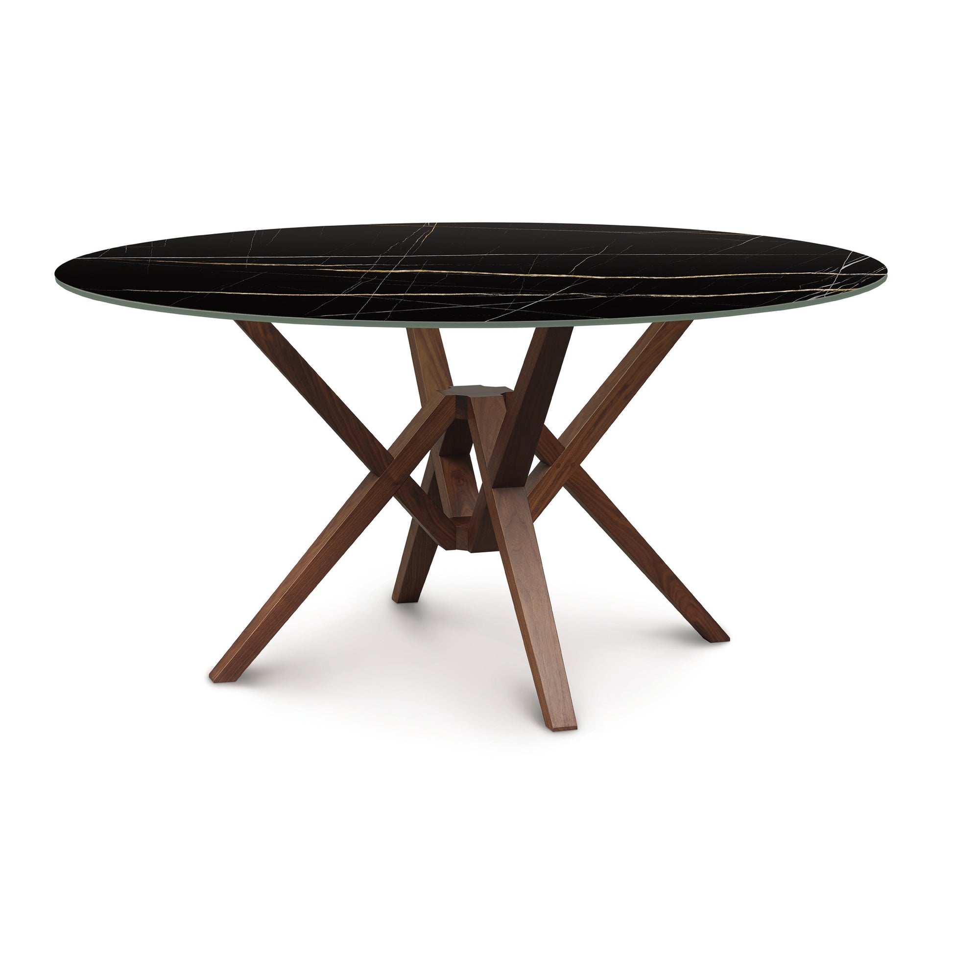 Exeter Round Table with sintered stone top and distinctive hardwood geometric legs by Copeland Furniture.