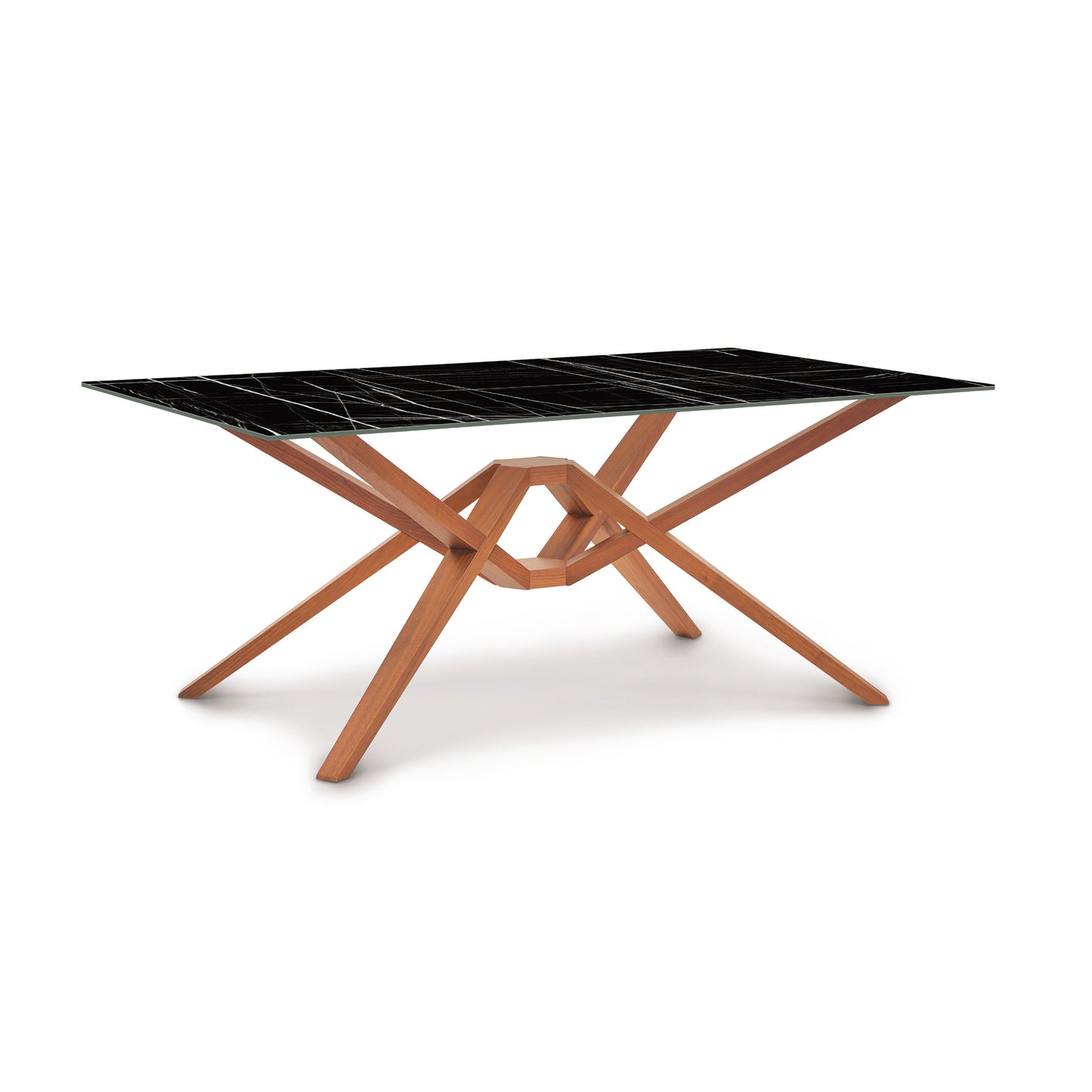 Exeter Table by Copeland Furniture with a black stone top and intricate sustainably sourced hardwood base.