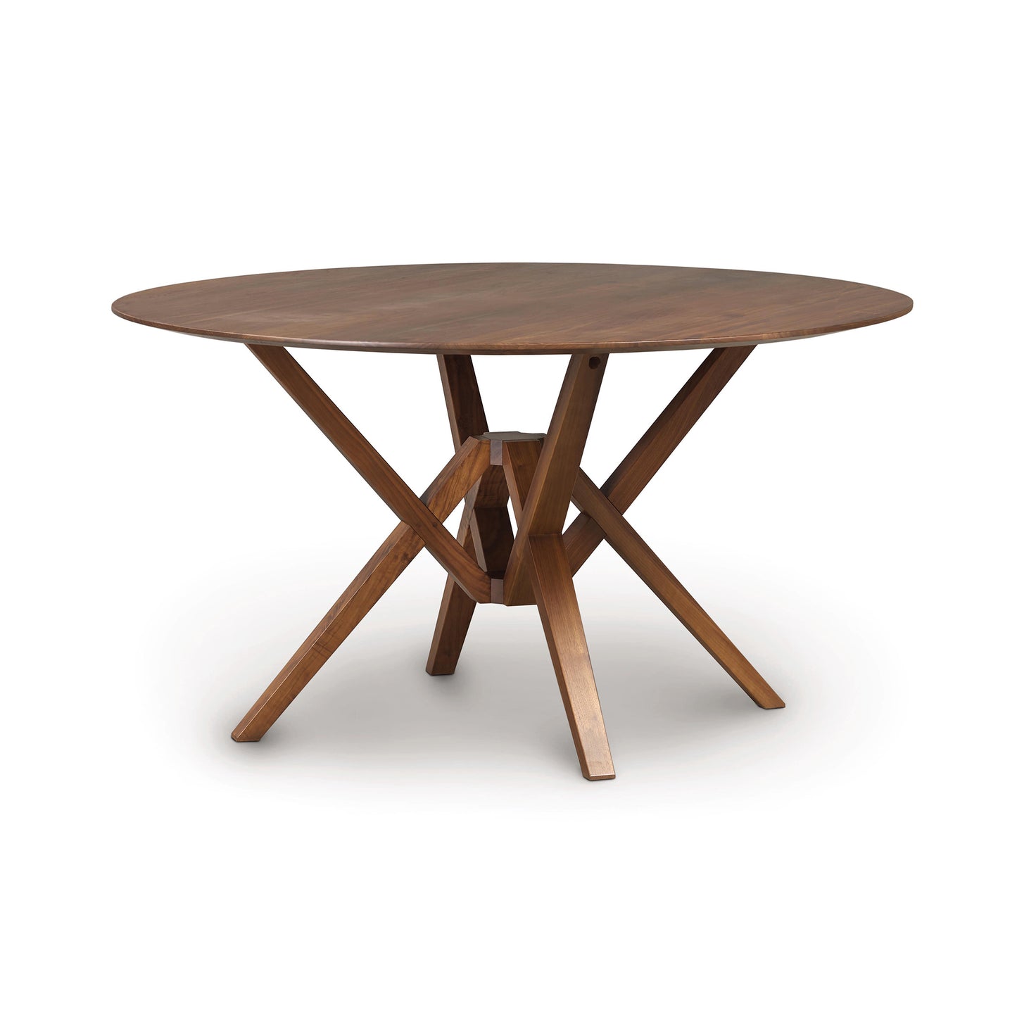A Copeland Furniture Exeter Round Solid Top Dining Table with an intersecting base design, crafted from sustainably harvested hardwoods, isolated on a white background.