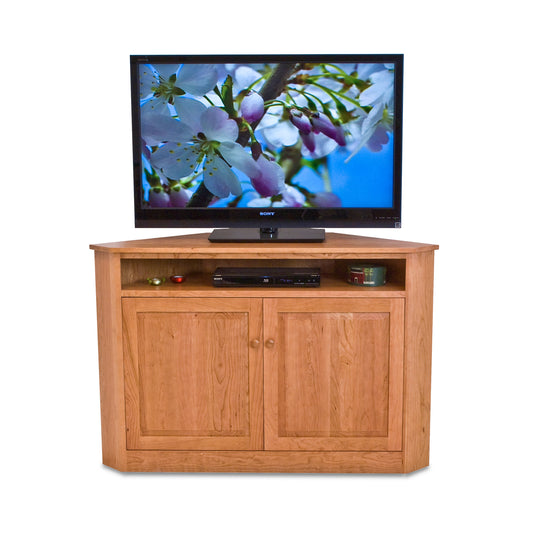 A Flat Screen Corner Entertainment Console from Lyndon Furniture with adjustable shelves, perfect for displaying your flat screen TV.