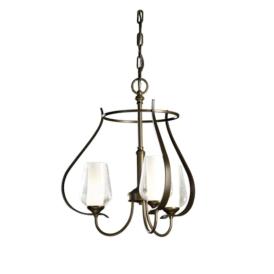 The Flora Chandelier by Hubbardton Forge features two glass shades suspended from a metal frame, crafted using environmentally safe metal forging techniques.