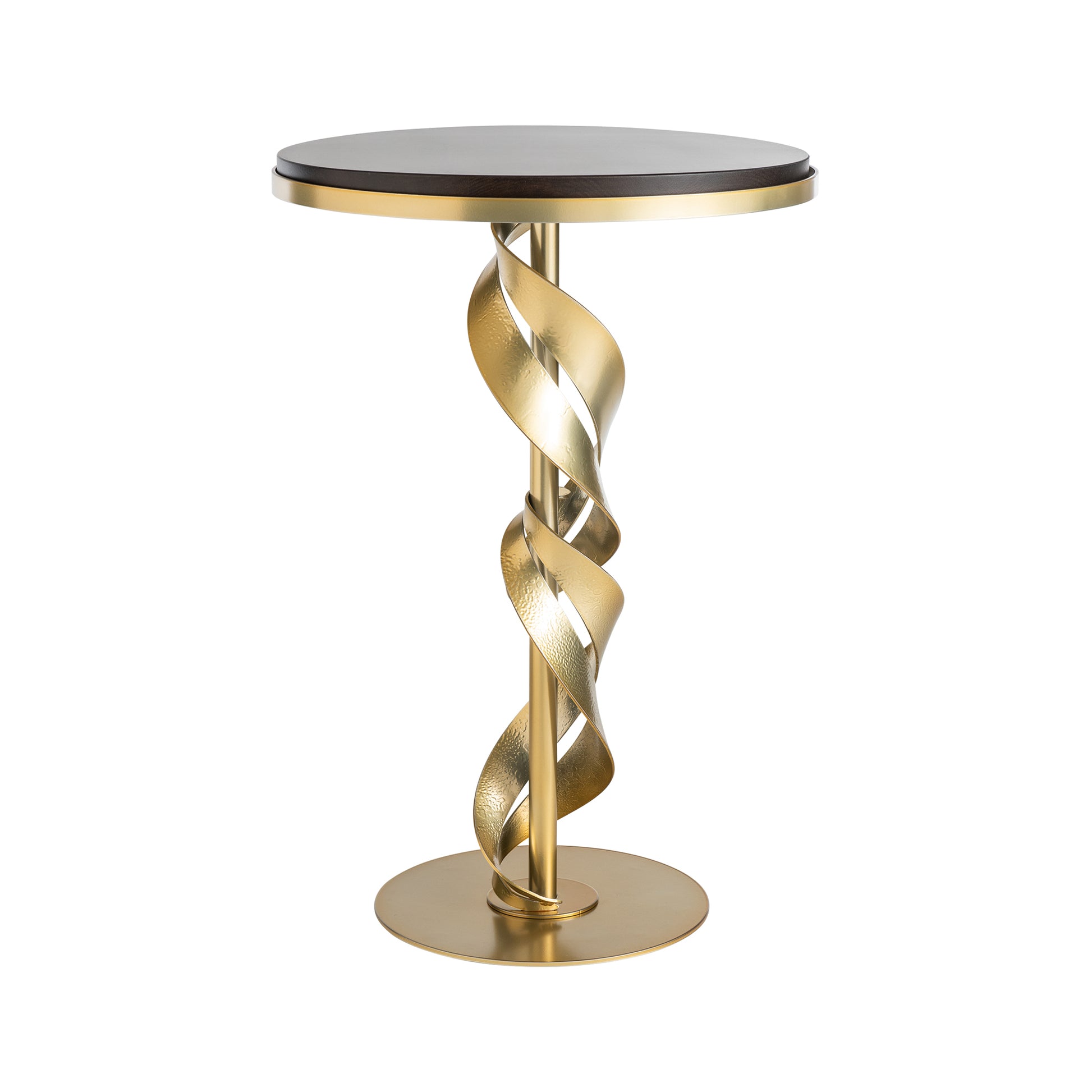 The Hubbardton Forge Folio Wood Top Accent Table features a dark tabletop that is beautifully complemented by a modern brass finish. Its base showcases two intertwined metallic ribbons, creating an artistic design, and it stands firmly on a circular metal foot, making it ideal for any contemporary space.