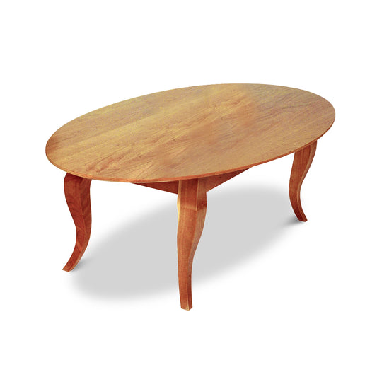 An upscale Lyndon Furniture French Country Oval Coffee Table with a natural cherry wooden top.