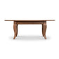 Lyndon Furniture French Country oval coffee table with elegant curved legs and rich walnut finish, side profile highlighting craftsmanship.