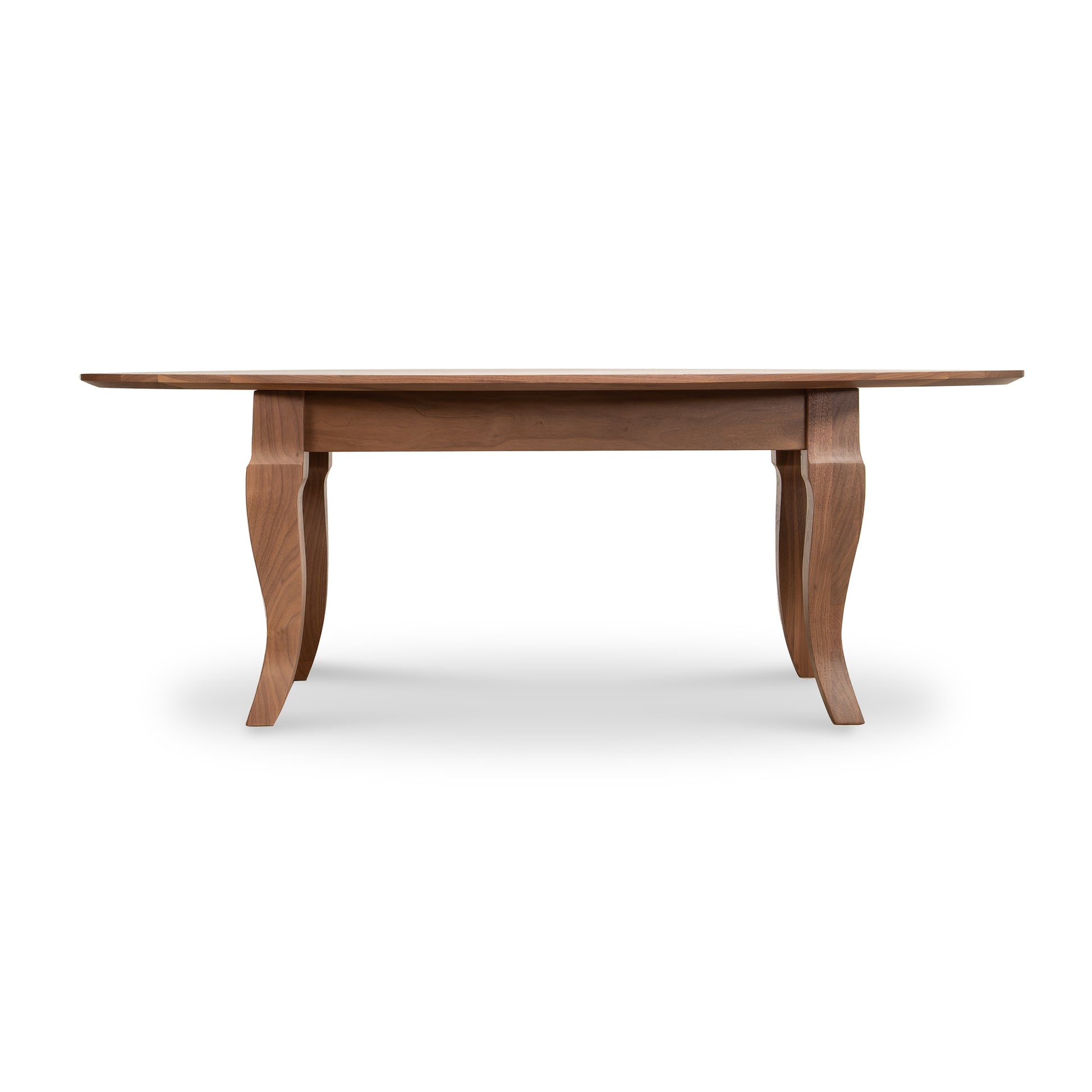 Lyndon Furniture French Country oval coffee table with elegant curved legs and rich walnut finish, side profile highlighting craftsmanship.