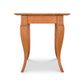 A small Lyndon Furniture French Country End Table with a curved top, offering a touch of luxury.