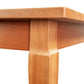 Handcrafted Vermont hardwood French Country Solid Top Dining Table featuring a smooth surface and tapered, geometric leg.
