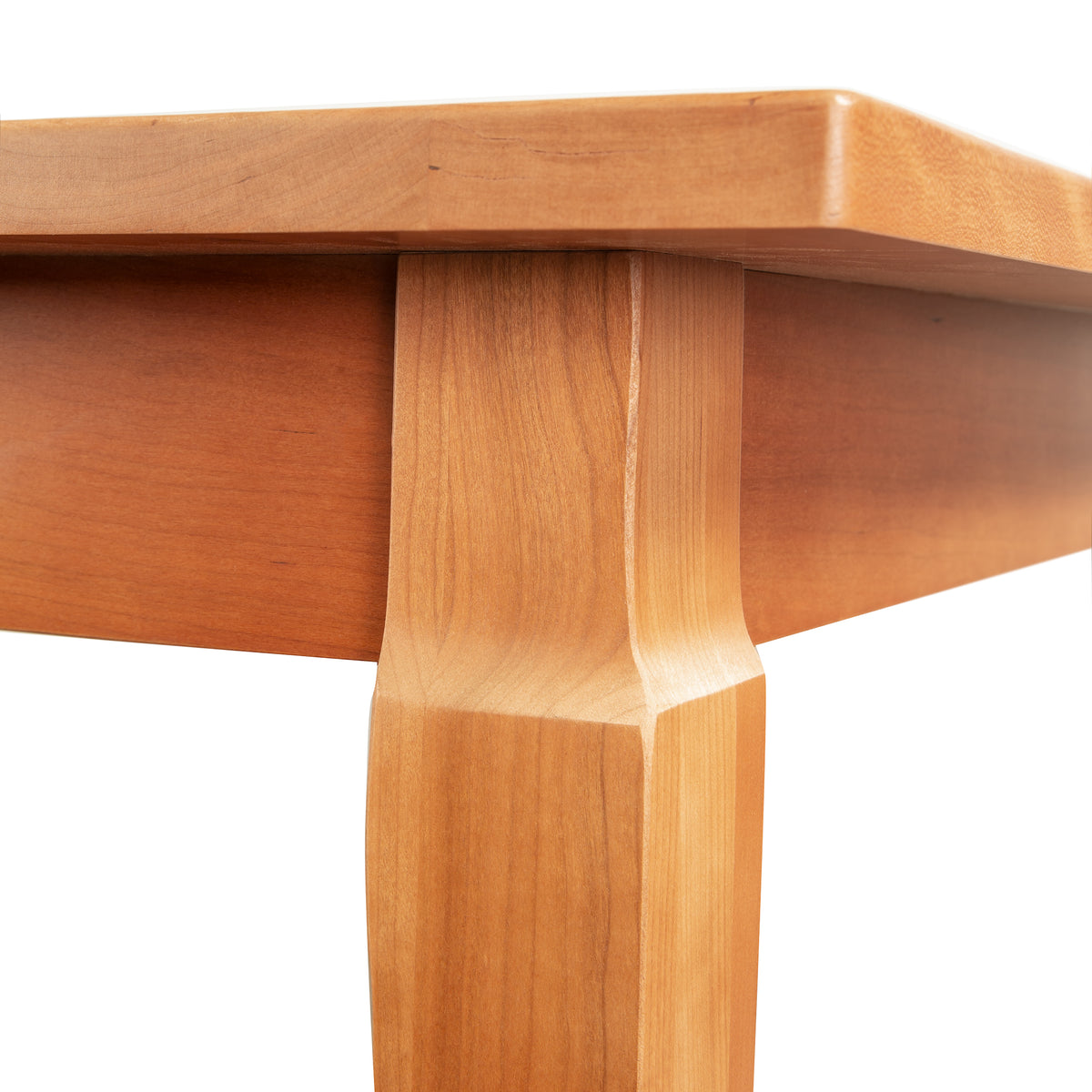 Handcrafted Vermont hardwood French Country Solid Top Dining Table featuring a smooth surface and tapered, geometric leg.