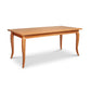 French Country Solid Top Dining Table, a handcrafted wooden rectangular table with tapered, curved legs.