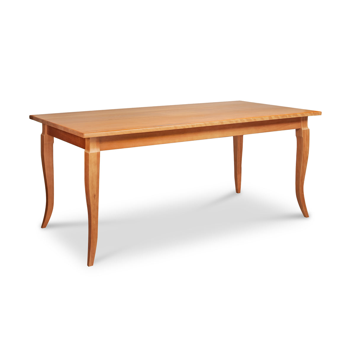 French Country Solid Top Dining Table, a handcrafted wooden rectangular table with tapered, curved legs.